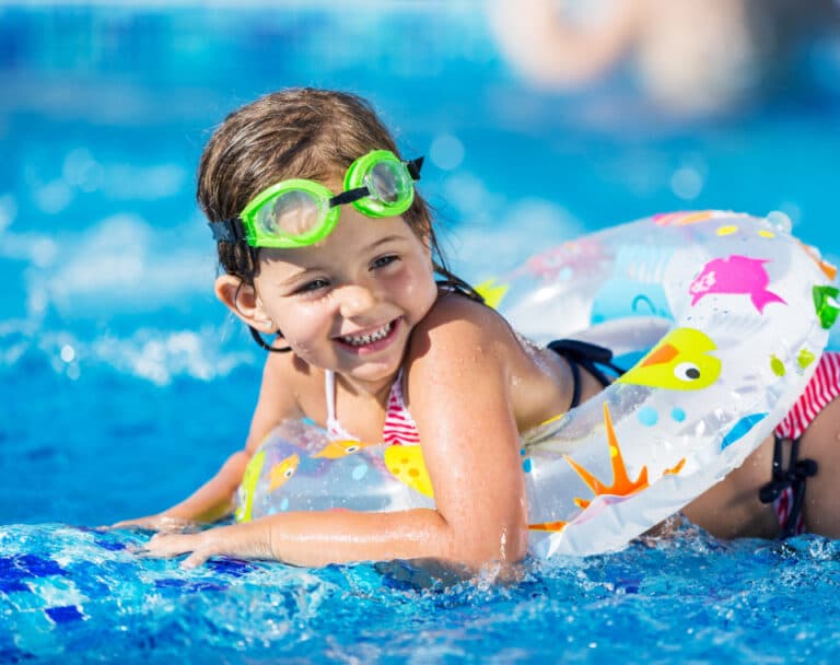Happy family enjoying their pool